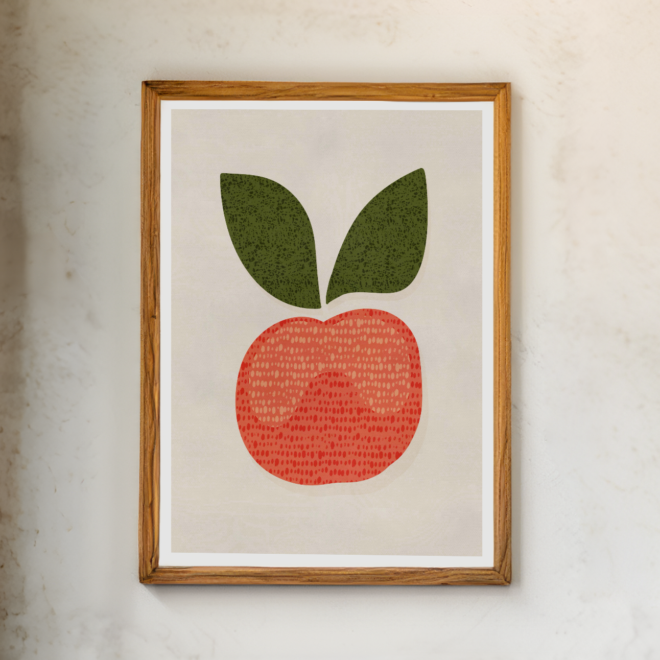 Äppelposter i guldram på vägg, grafisk illustration i rostrött och grönt