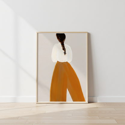 Poster lutad mot vägg med en illustration av kvinna med bruna byxor
