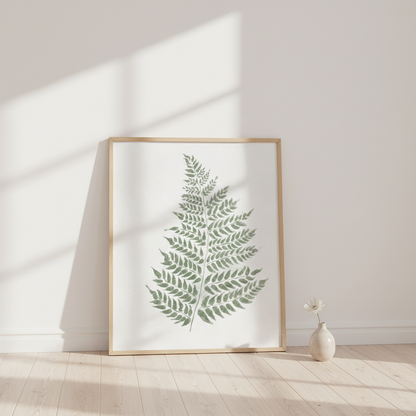 Poster lutad mot vägg med botanisk poster föreställande en ormbunke